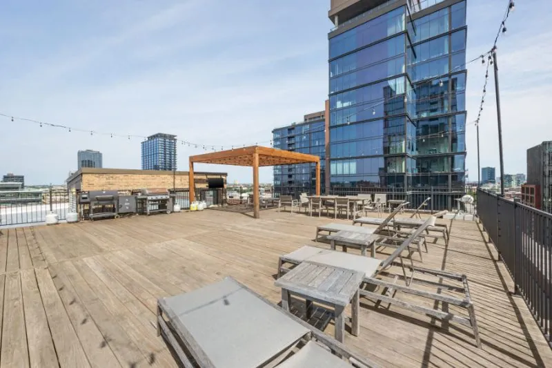Rooftop deck with pergola, lounge seating, and Fulton Market skyline views