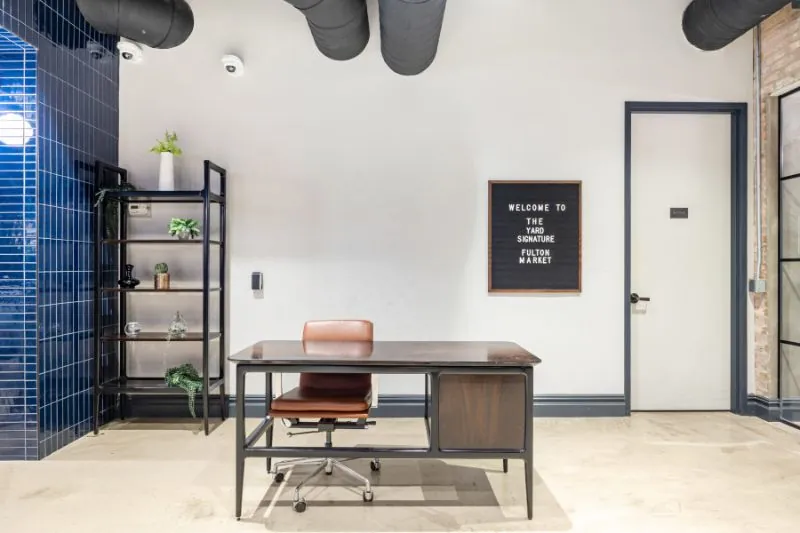 Reception desk with a welcome letterboard at The Yard Signature Fulton Market